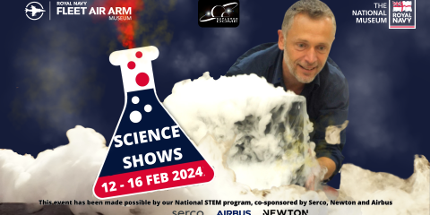 Man standing behind a smoking science experiment.